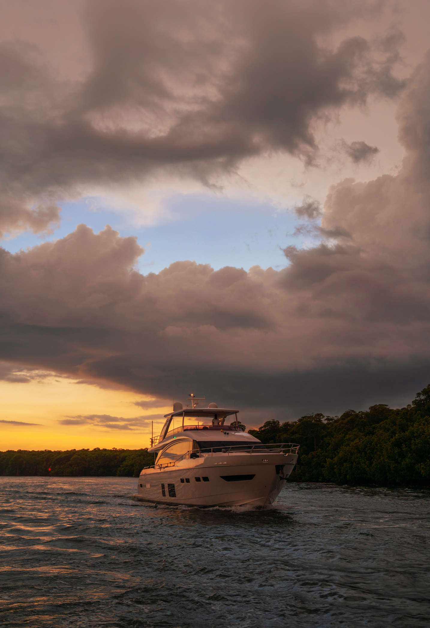 Boat navigating at sunset at the Haulover inlet in florida