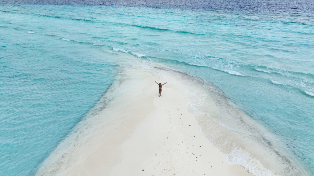young girl in a sandbar vacation after a boat tour