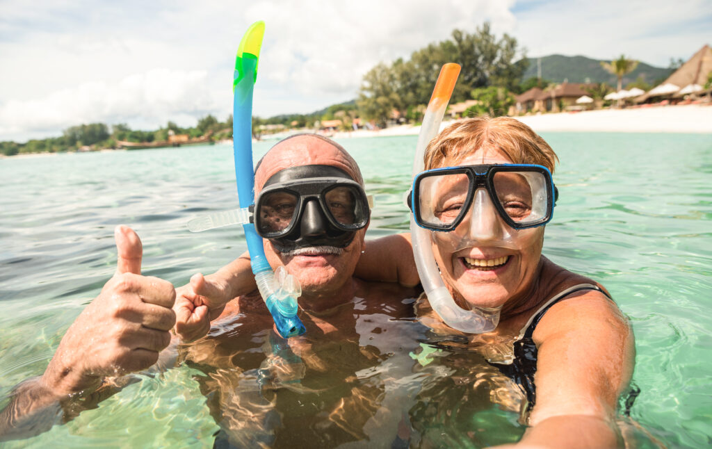 senior couple during a snorkeling boat tour
